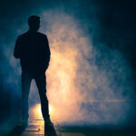 the man standing in the fog. evening night time